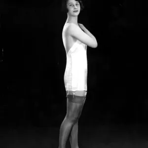 1920s Underwear Print: A model wears a Campbells corset with suspender belt
