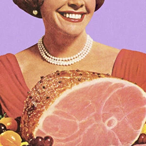 1950s housewife holding a ham dinner, smiling