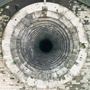 An aerial daytime view of a sinkhole in the Ladybower Reservoir - stock photo