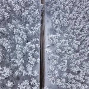 Aerial drone view of road in idyllic winter landscape Aerial drone view of road in idyllic winter landscape