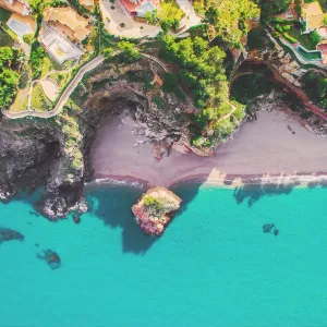 Aerial picture taken with drone of a beautiful beach with turquoise water and island in the Mediterranean Costa Brava Aerial picture taken with drone of a beautiful beach with turquoise water and island in the Mediterranean Costa Brava