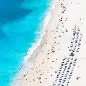 Aerial view of beach crowded with people in summer