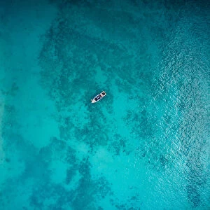 Aerial view of boat on crystal clear water in Phi Phi Island, Krabi, Thailand