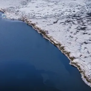 Aerial view of coastline and snow covered lava fields, Iceland Aerial view of coastline and snow covered lava fields, Iceland