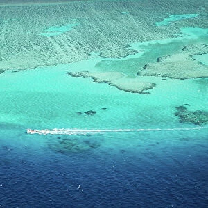 Aerial view of motorboat on the barrier reef, Fiji