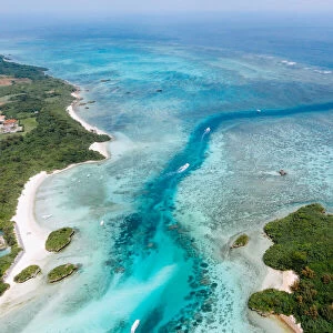 Aerial view of tropical beach and clear water with coral reef, Kabira Bay
