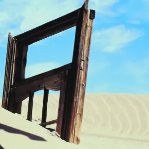 africa, barren, buried, copy space, day, desert, door, dunes, frame, jutting, kolman