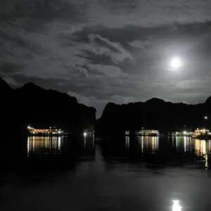 Anchored Junk boats in Halong Bay at night Anchored Junk boats in Halong Bay at night