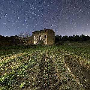 Ancient farmhouse a night of starry sky