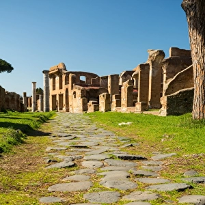 An ancient road in the ruins of the Ancient Roman harbour city of Ostia Antica in Rome, Italy