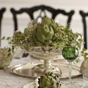 Artichoke on fine china in a luxurious ambience