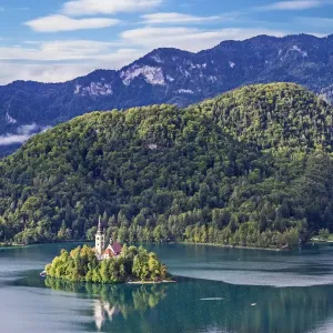 Assumption of Mary Church on an island at Lake Bled, and Julian Alps in background, Gorenjska, Balkan Peninsula, Carniola, Slovenia