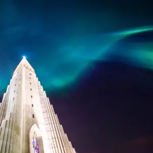 aurora borealis display over famous Hallgrimskirkja church, reykjavik, Iceland