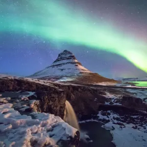Aurora above mountain Kirkjufell mountain Aurora above mountain Kirkjufell mountain