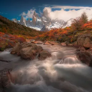 Autumn view of cascade in Patagonia with Mount Fitzroy background Autumn view of cascade in Patagonia with Mount Fitzroy background