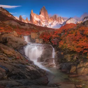 Autumn view of cascade in Patagonia with Mount Fitzroy background Autumn view of cascade in Patagonia with Mount Fitzroy background
