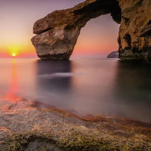 The Azure Window natural arch at sunset