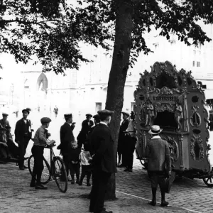 Barrel Organ Print circa 1900: A scene of a town in Holland Barrel Organ Print circa 1900: A scene of a town in Holland