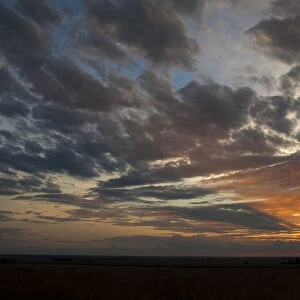 A Beautiful African sunset with sun rays over the agricultural farm lands of the North West Province in South Africa