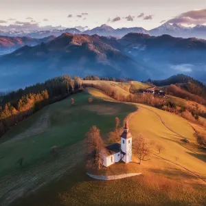 Beautiful Sunrise Landscape Of Saint Thomas Church and Julian Alps In Slovenia