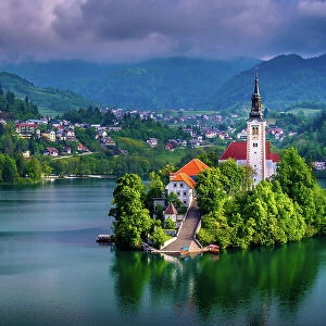 Beautiful view of Pilgrimage Church of the Assumption of Maria, famous Bled Island (Blejski otok), and scenic Bled Lake, with Julian Alps in the background, Slovenia, Europe
