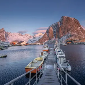 Beautiful winter landscape of picturesque harbor with fishing boat