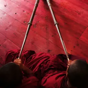Bhutan Print: Elevated View of Two Monks Playing Horns in Jakar