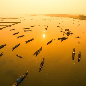 Boats in Tam Giang lagoon in sunrise from drone. Hue, Vietnam Boats in Tam Giang lagoon in sunrise from drone. Hue, Vietnam