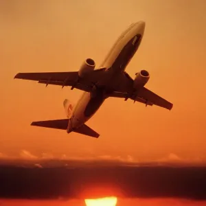 Boeing 737 taking off at sunset Boeing 737 taking off at sunset