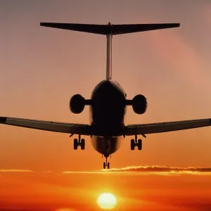Boeing MD-80 airliner landing at sunset Boeing MD-80 airliner landing at sunset
