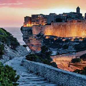 Bonifacio, Corsica, France. Sunset over cliffs and town