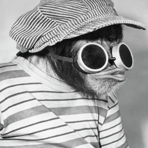 Bonzo Wearing Train Engineer Hat and Goggles Bonzo Wearing Train Engineer Hat and Goggles