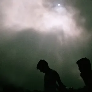 Boys Silhouette against Dramatic Sky Boys Silhouette against Dramatic Sky