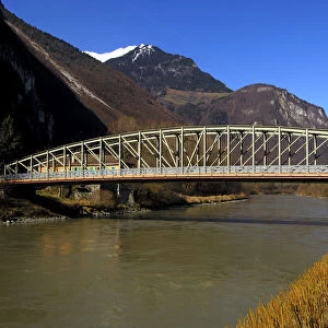 Broadside of a steel bridge crossing Rhone River, near Chessel, Vaud, Switzerland, Europe