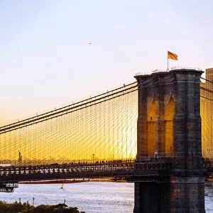 Brooklyn Bridge and Manhattan skyline at sunset, New York City, NY, United States