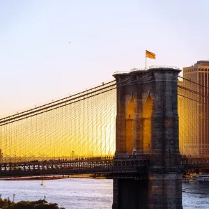 Brooklyn Bridge and Manhattan skyline at sunset, New York City, NY, United States Brooklyn Bridge and Manhattan skyline at sunset, New York City, NY, United States