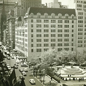 Busy street at Plaza Hotel, New York City, (B&W), (Elevated view)