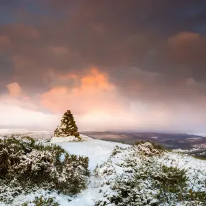 Cairn on snow covered hill fort at Cwmyoy near Abergavenny in the Black Mountains Cairn on snow covered hill fort at Cwmyoy near Abergavenny in the Black Mountains