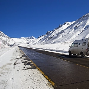 a camper van on the side of a road in parque provincial aconcagua in winter
