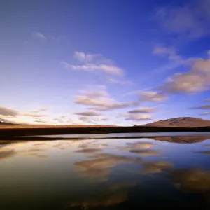 Canada, Yukon Territory, cumulus clouds reflected in Two Moose Lake in morning light Canada, Yukon Territory, cumulus clouds reflected in Two Moose Lake in morning light