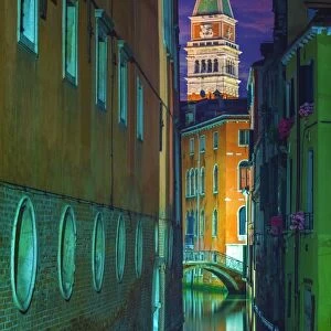 Canal in Venice in the night with the Campanile in the background