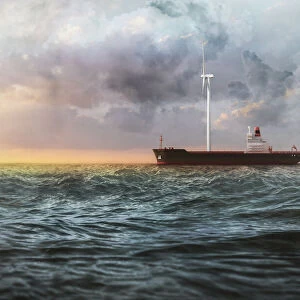 Cargo ship on the sea with a giant wind turbine on the deck