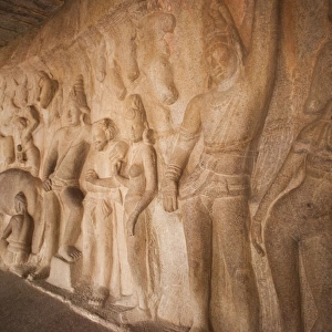 Carving details of Krishna lifting Govar-dhan Hill in order to protect the people of Vrindavan from the fury of Indra at Krishna Mandapa, Mahabalipuram, Kanchipuram District, Tamil Nadu, India
