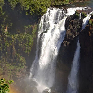 Cascades with rainbow Iguazu Waterfalls Argentina Brazil