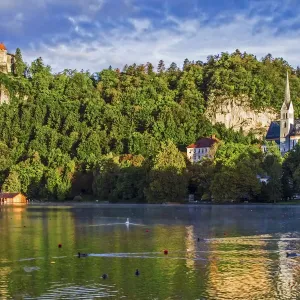 Castle rises on cliffs above Lake Bled, Slovenia