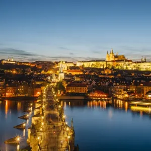 Charles Bridge and Prague illuminated skyline after the sunset, Prague, Czech Republic Charles Bridge and Prague illuminated skyline after the sunset, Prague, Czech Republic