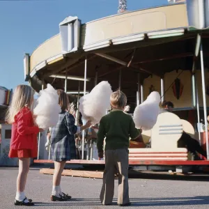 Children With Cotton Candy Watching Merry-Go-Round Children With Cotton Candy Watching Merry-Go-Round