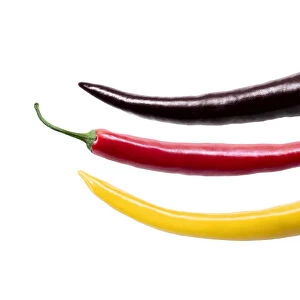 Three chili peppers in the German national colors, photo composing