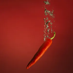 chilli splashed into water chilli splashed into water