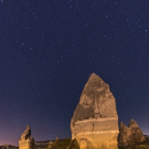 Chimney rocks of Goreme at night with stars